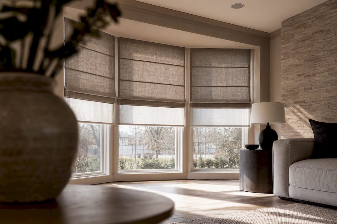 Large window with modern motorized roller shades