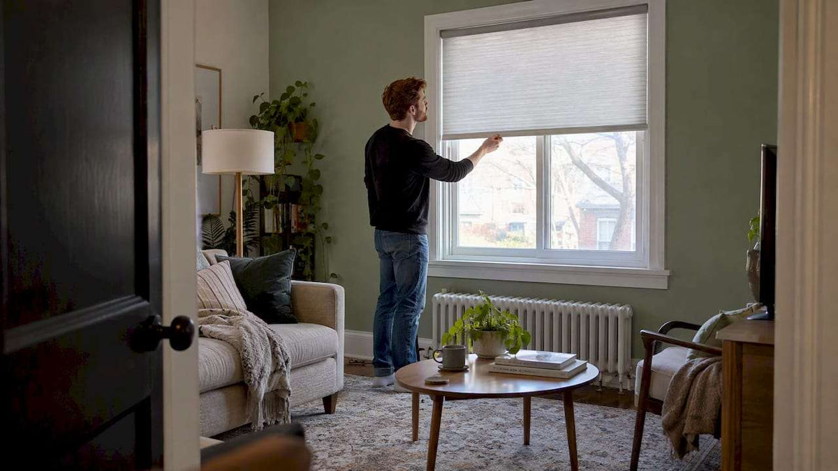Renter testing a cordless shade in an apartment