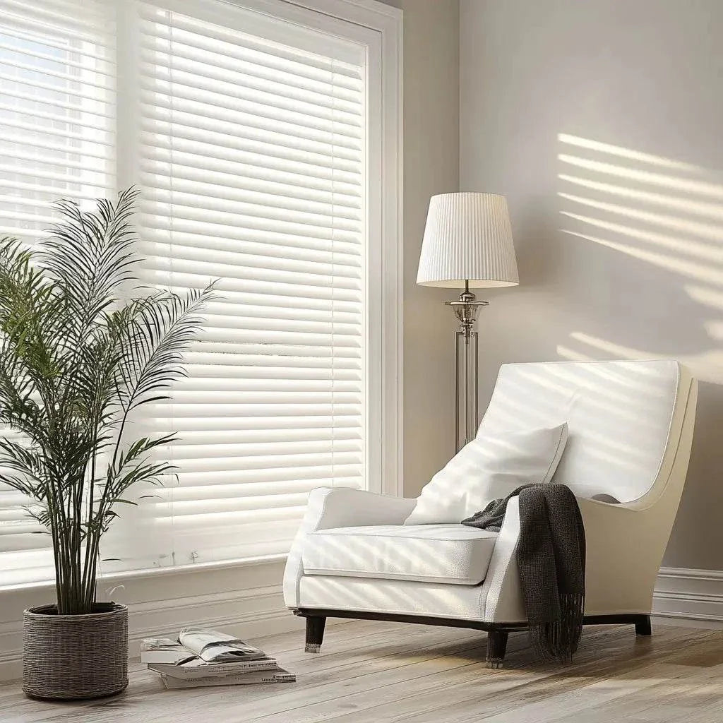 Value Blinds™ premium motorized faux wood blinds with 2-inch slats in a bright living room setting