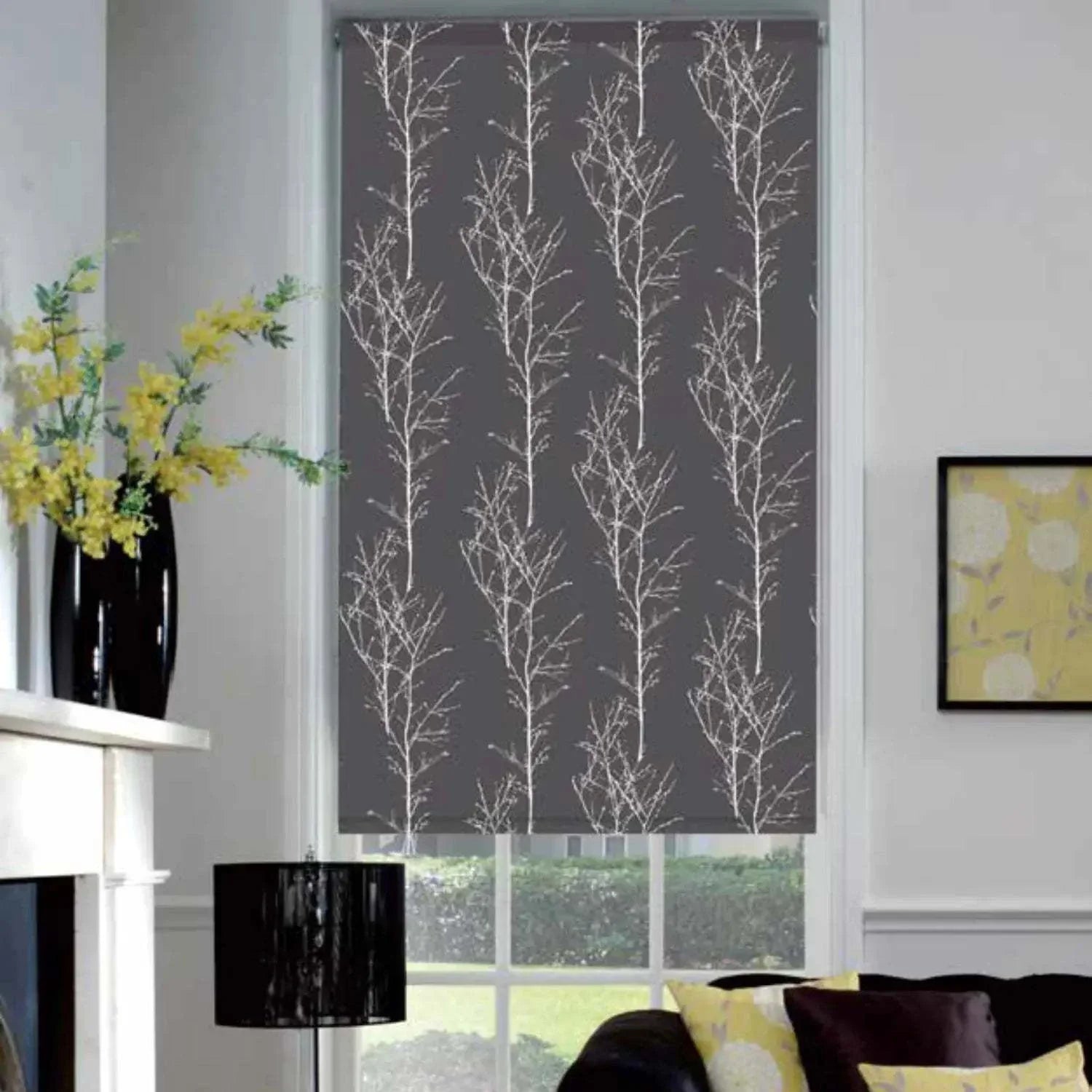 Value Blinds™ Elegant roller shades with motorization, featuring leafy pattern in a stylish living room.